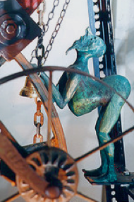 oxidised figure of a man on a wheel